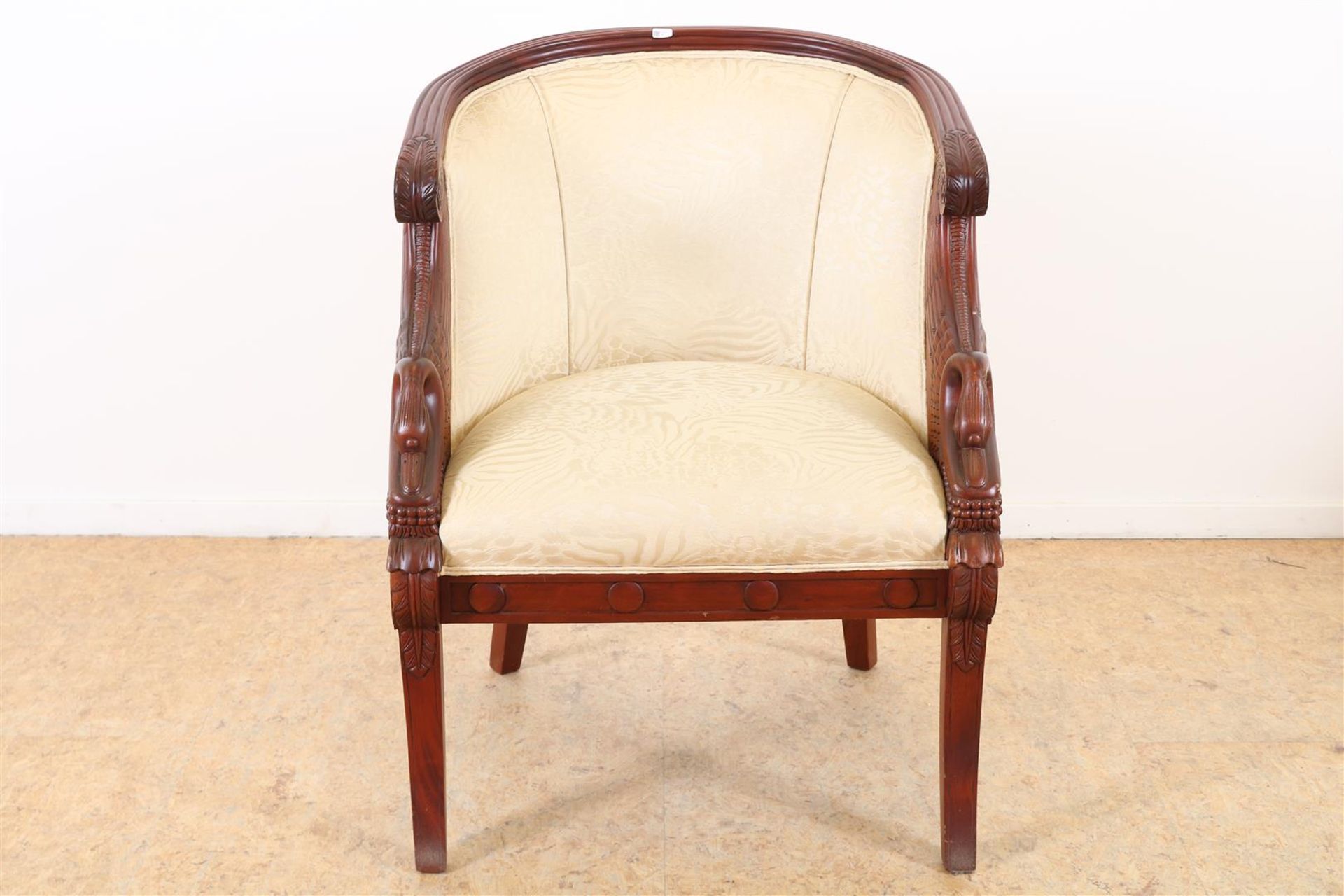 Mahogany Empire style armchair with cream fabric and stabbed swans, 20th century.