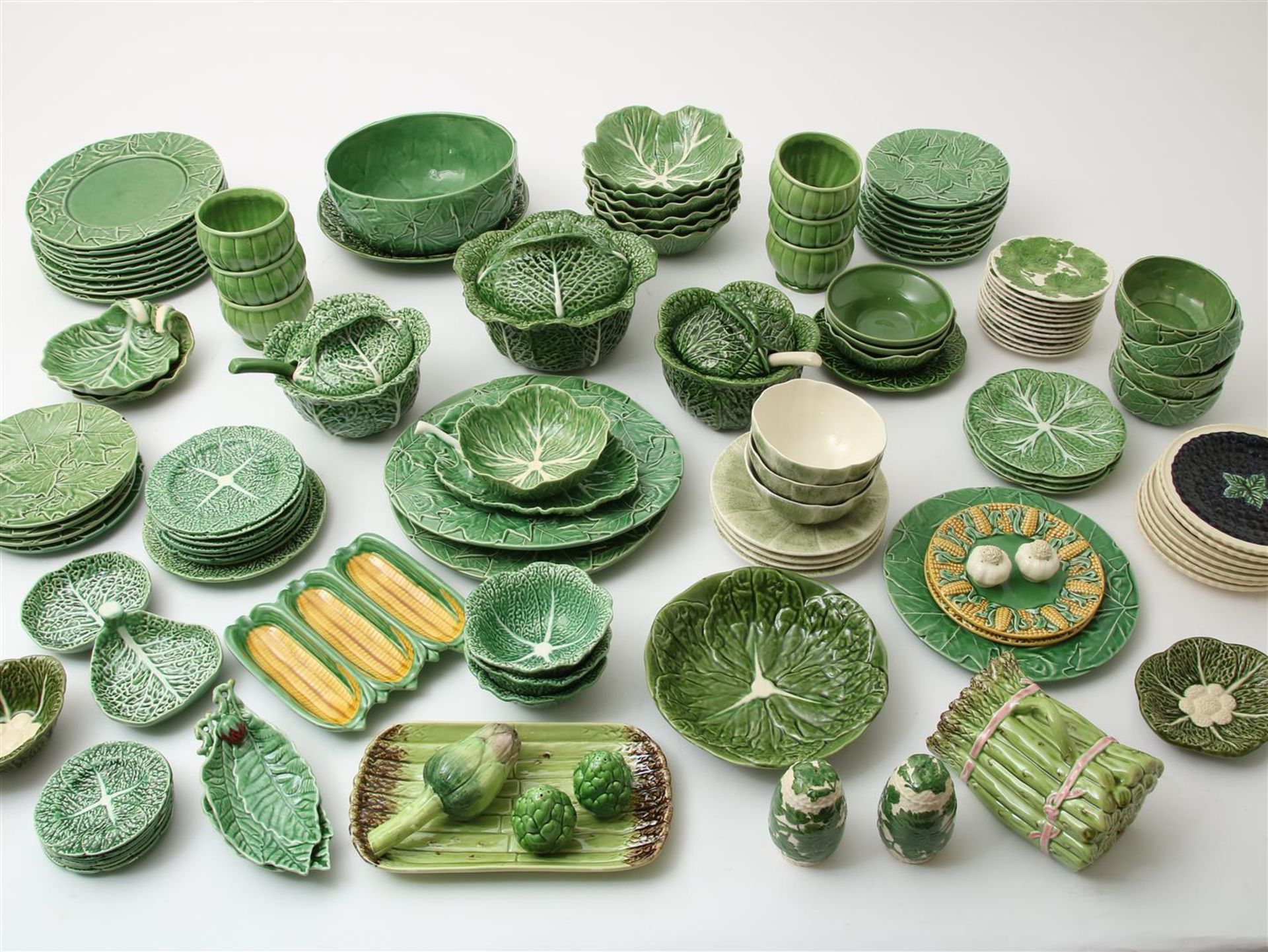 Very extensive (approximately 110-piece) green glazed earthenware cabbage service, including