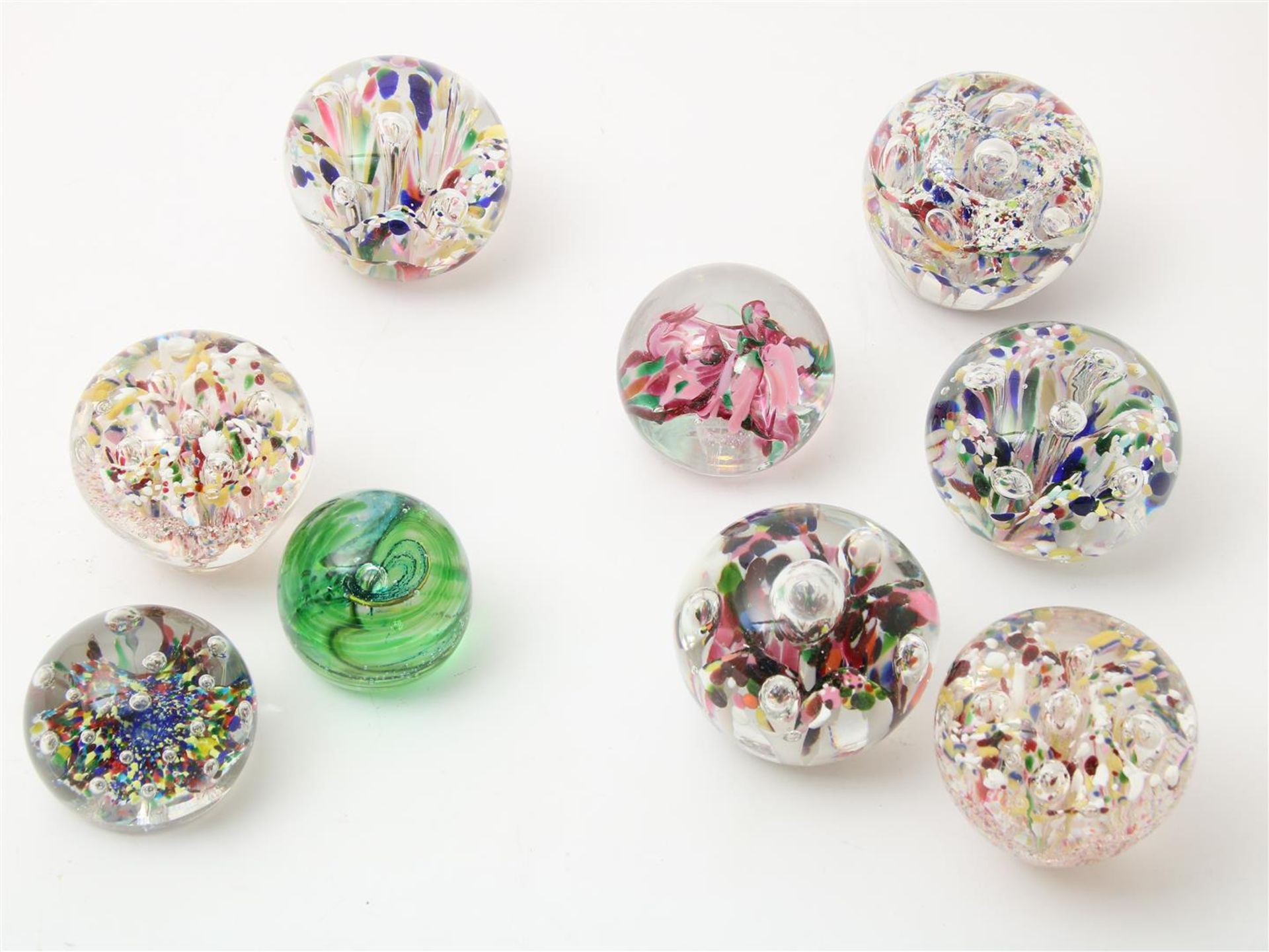 Series of 9 thick glass paperweights, with enclosed flower and ball decor, decors, probably Murano