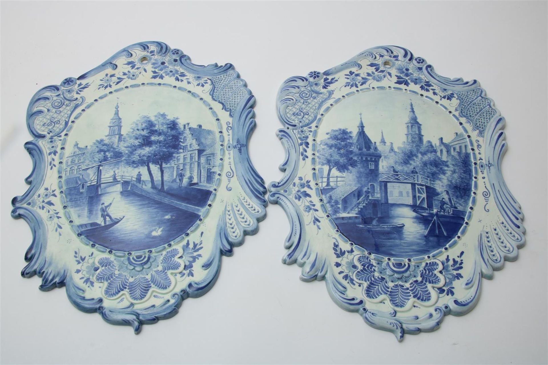 Set Delft blue pottery plaques with decor of Amsterdam canal view, marked on the back, h. 50, w.