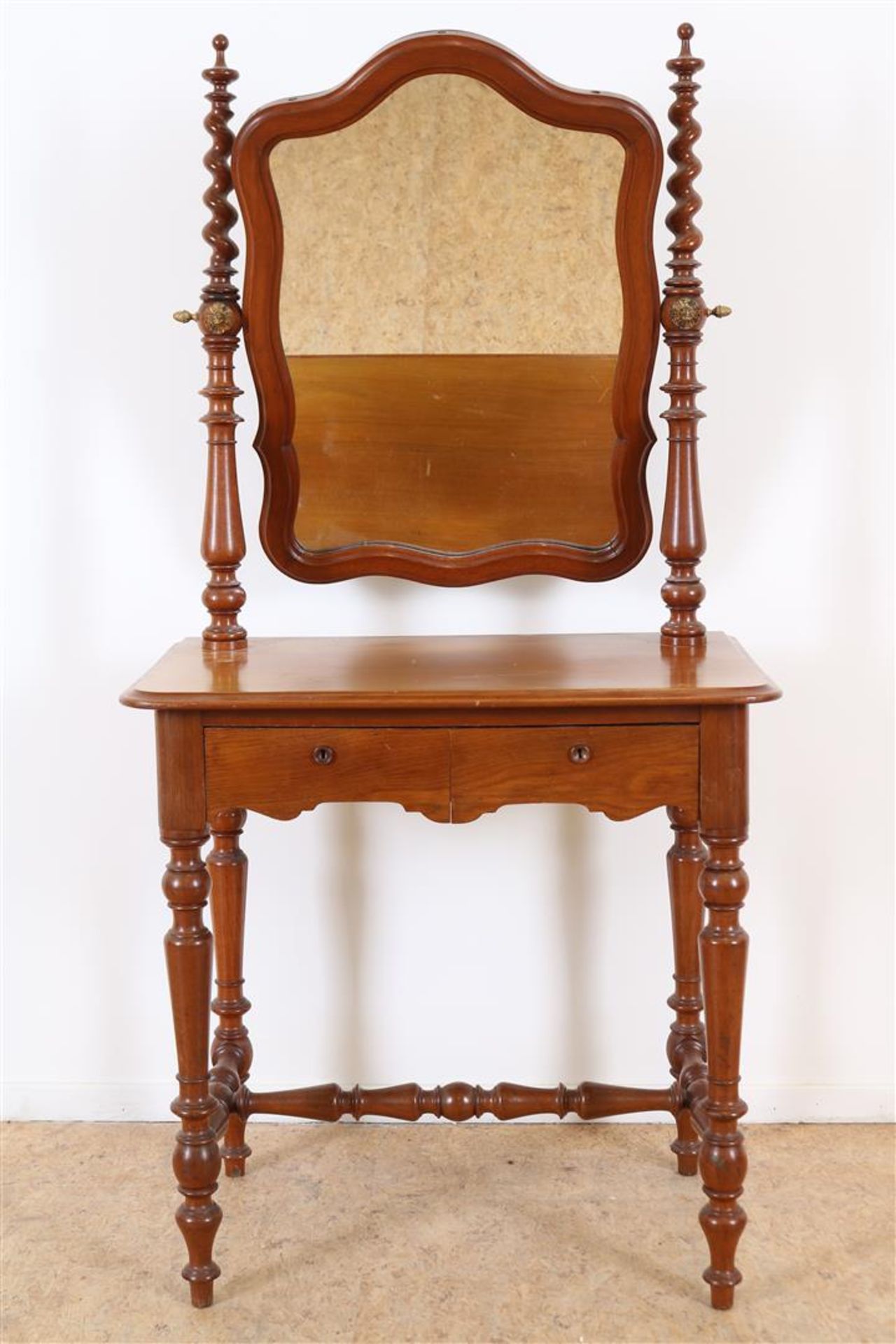 Mahogany Biedermeier dressing table with tilting mirror flanked by turned pilasters, 2 drawers on