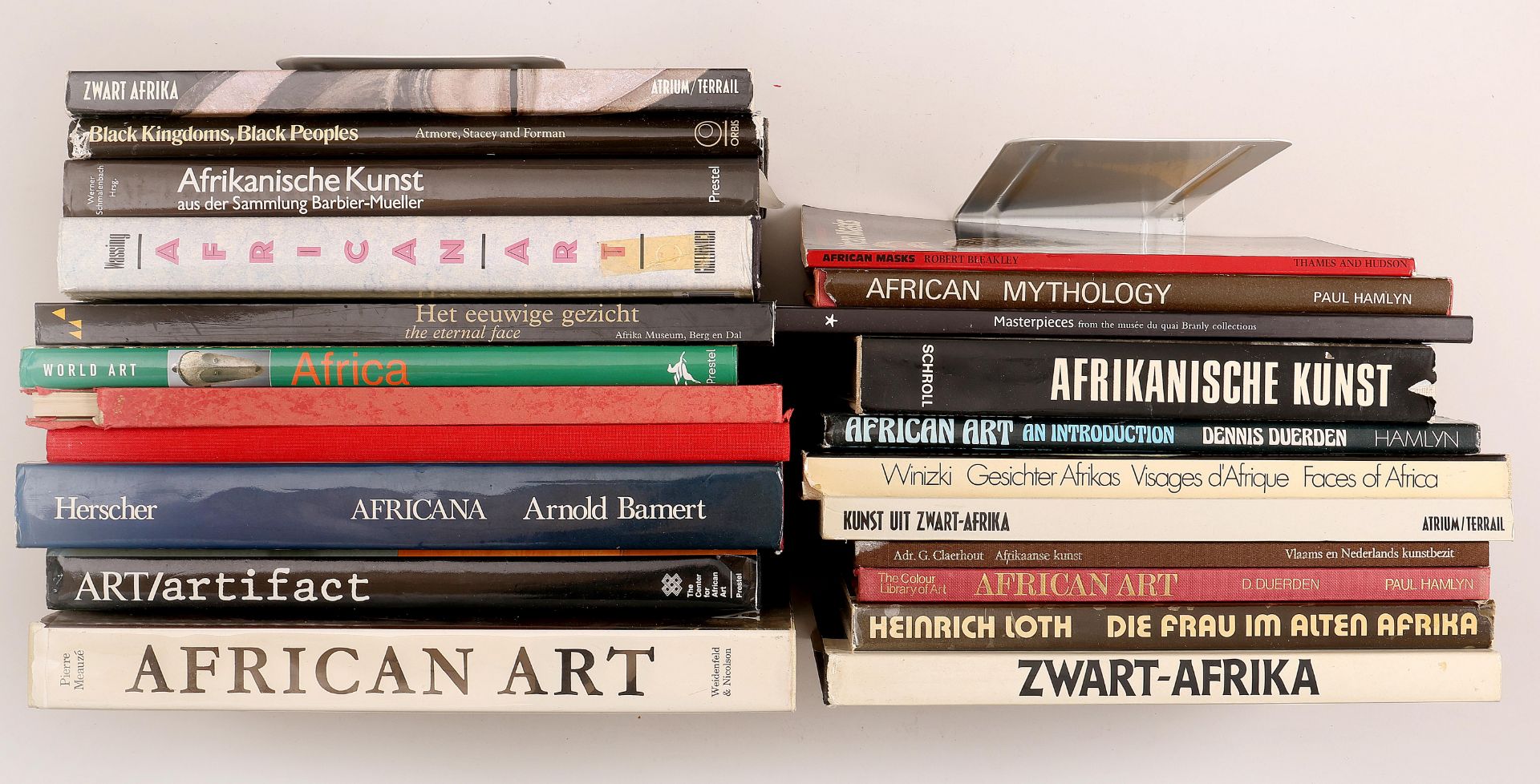 Box with various publications on African culture, arts and religions. English, German and Dutch