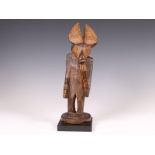 Cameroon, possibly Tikar, an anthropo-zoomorphic standing figure.