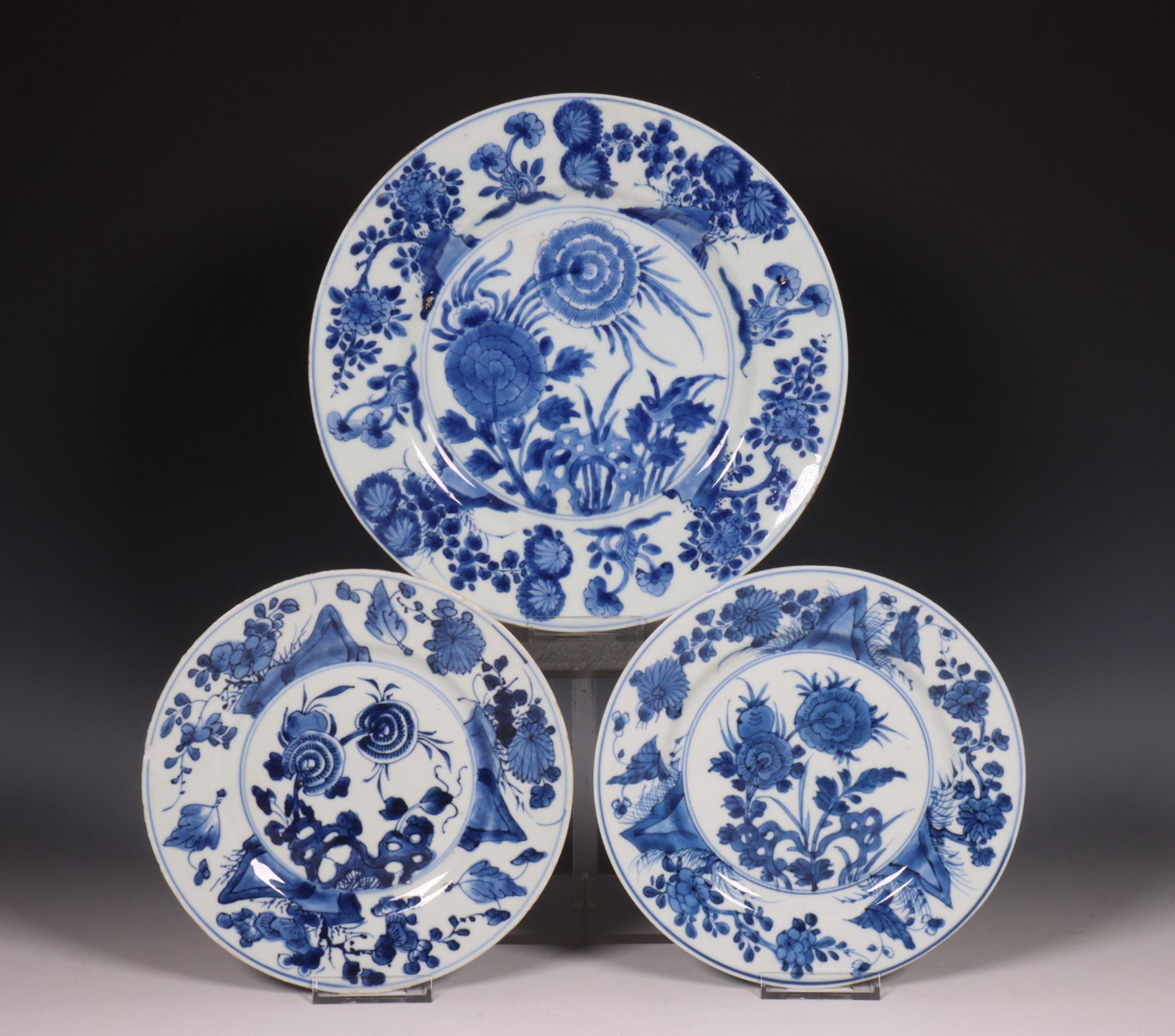 China, three blue and white porcelain 'aster' plates, 18th century,