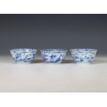 China, set of three blue and white porcelain cups, Kangxi period (1662-1722),