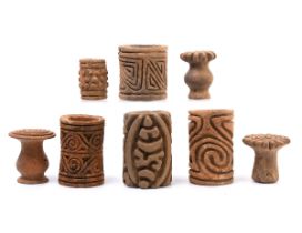 Columbia, a collection of five terracotta rolling seals and three earthenware stamps, possibly Quimb