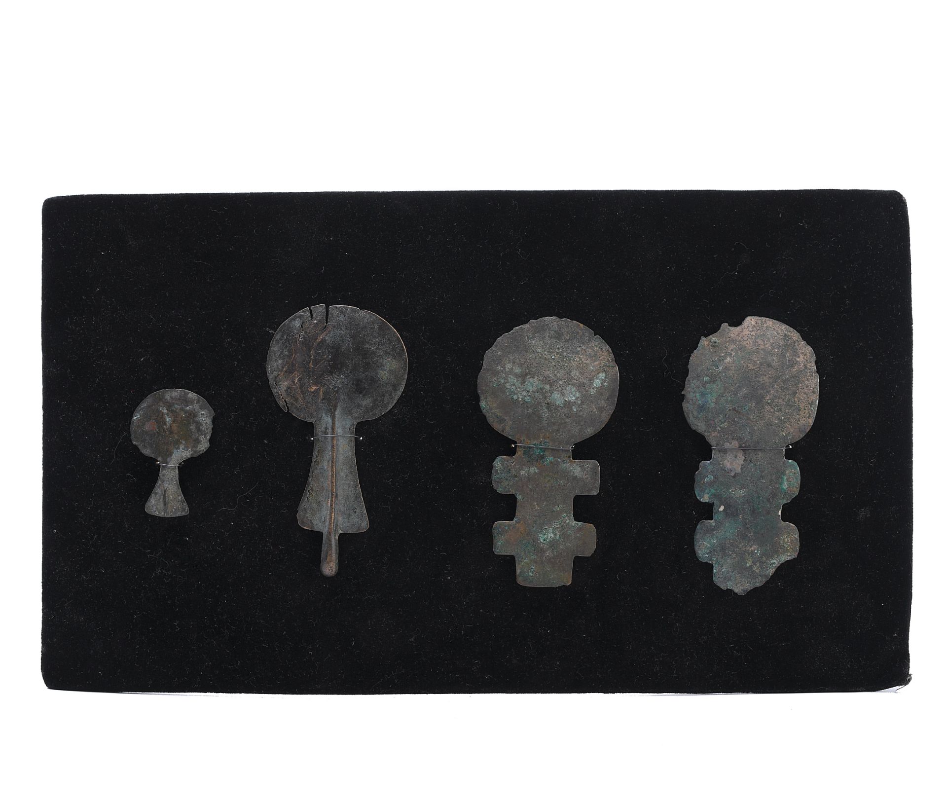 Four Anatolian bronze ornaments for a horse harnas, ca. 1st Mill BC, in the kusura figure style.