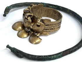 Antique bronze armlet, a guiled ring with markings on the inner side and a bronze antique amulet