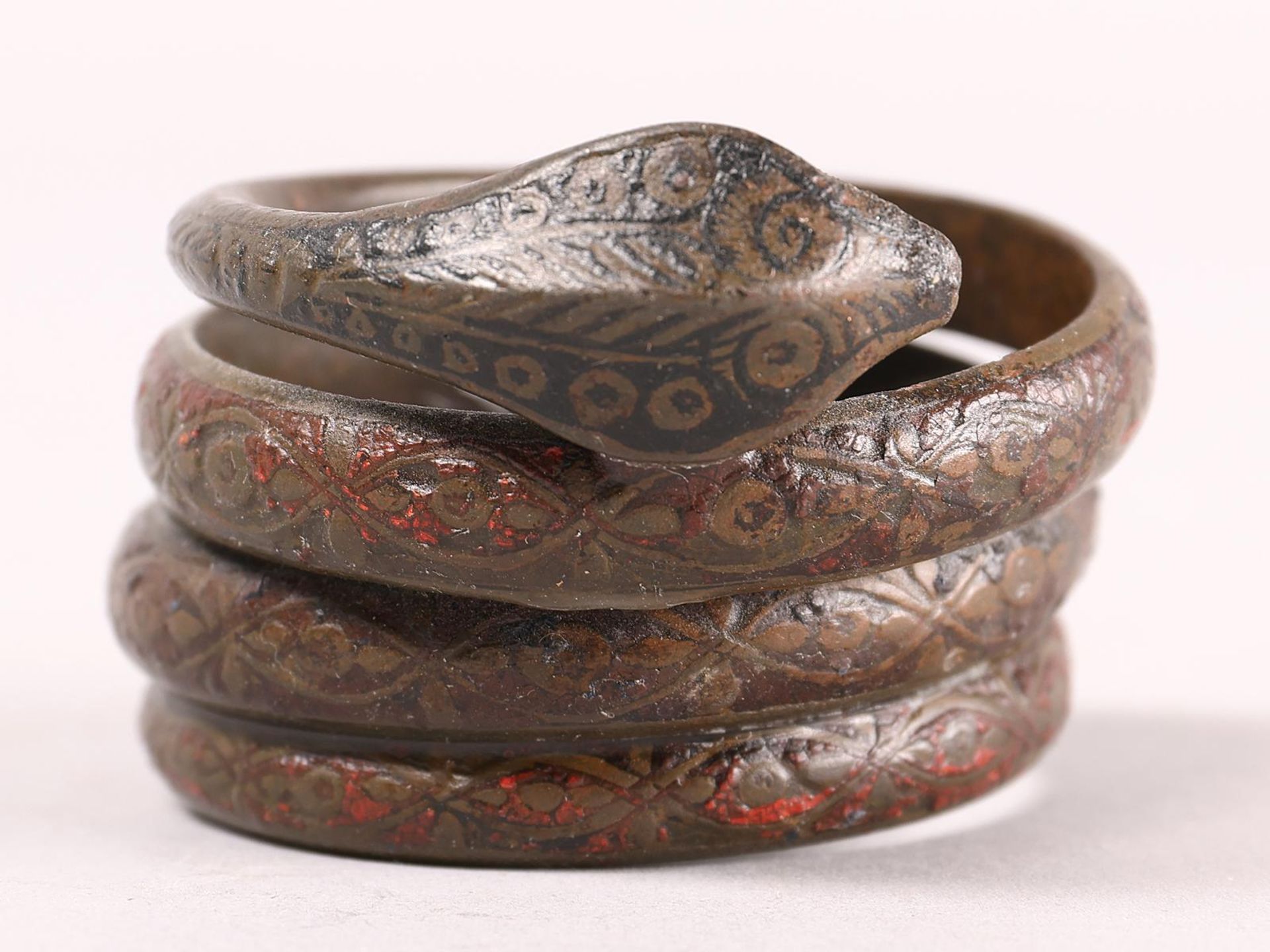 A antique coiled bronze snake armlet, - Image 2 of 6