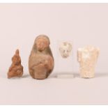 A antique stucco head, a stucco torso, a terracotta half female figure and a fragment of a relief de
