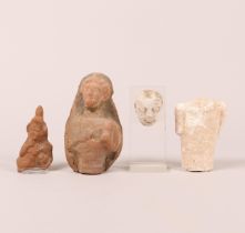 A antique stucco head, a stucco torso, a terracotta half female figure and a fragment of a relief de