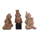 Possibly Roman, two earthenware sculptures of seated figures, possibly Bachanten and a Egypte, a ter