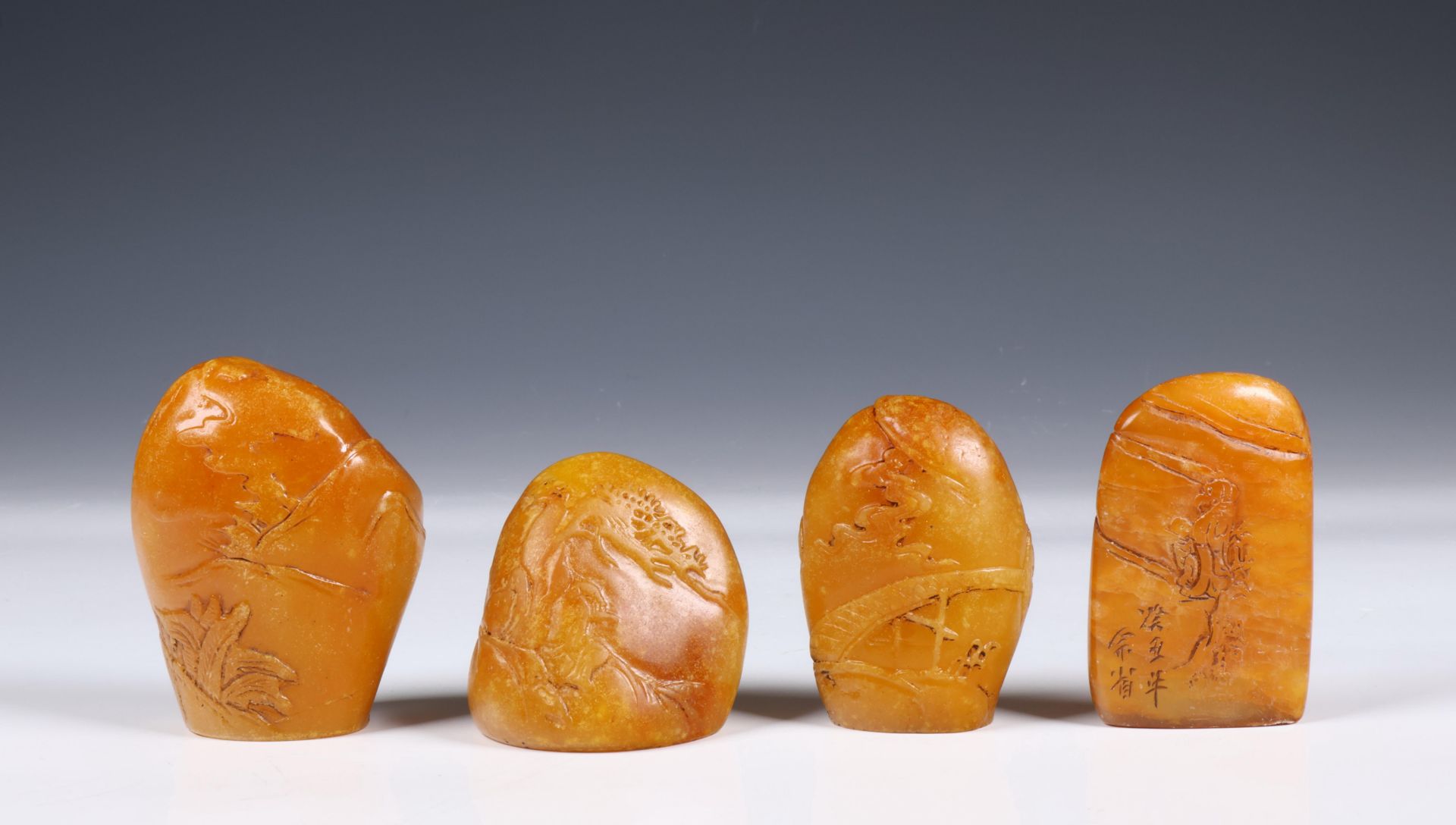 China, four shoushan soapstone seals/ paperweights,
