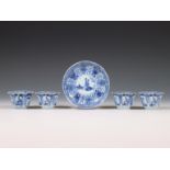 China, set of four blue and white porcelain cups and one saucer, 18th century,