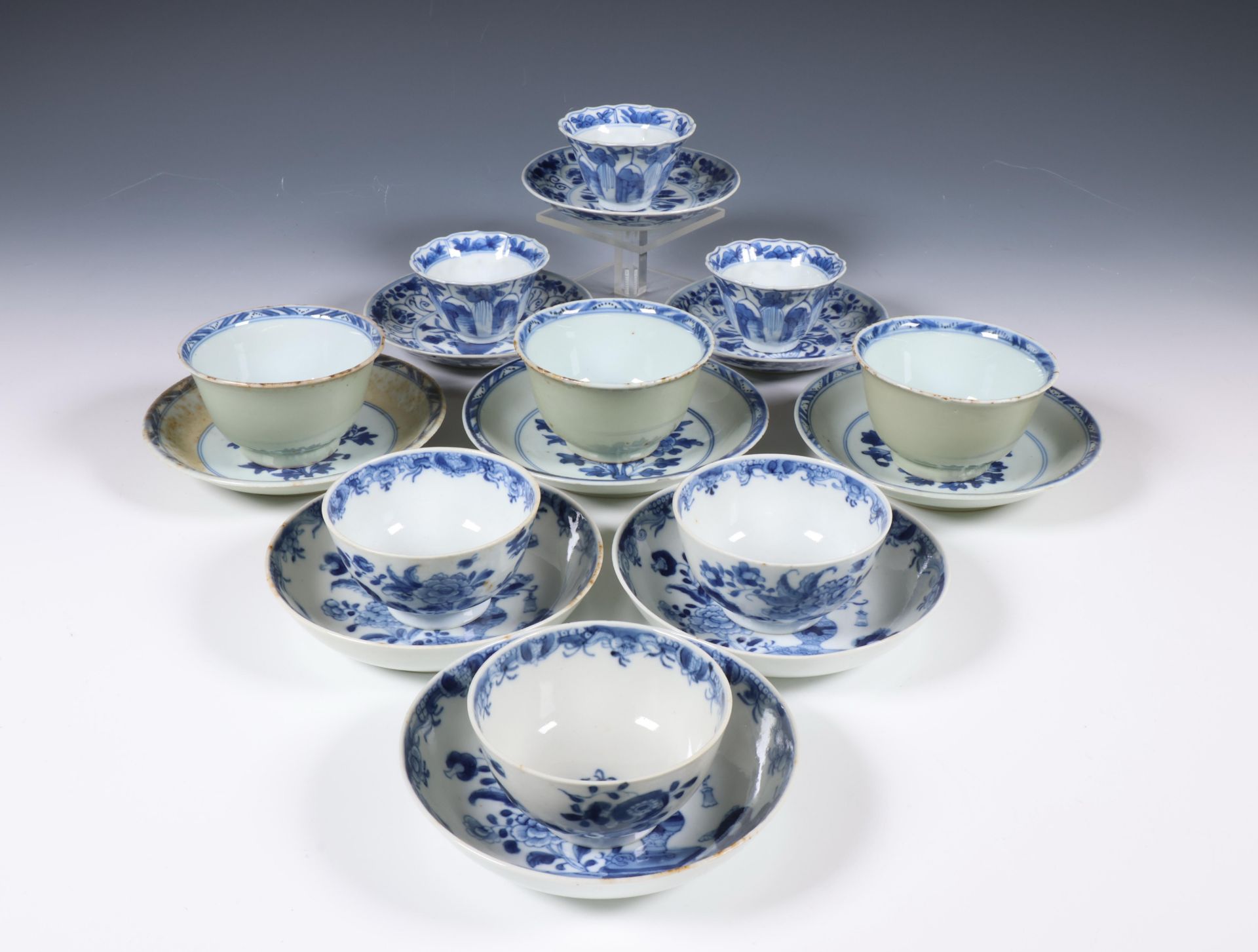 China, collection of blue and white porcelain 'floral' cups and saucers, Kangxi period (1662-1722) a