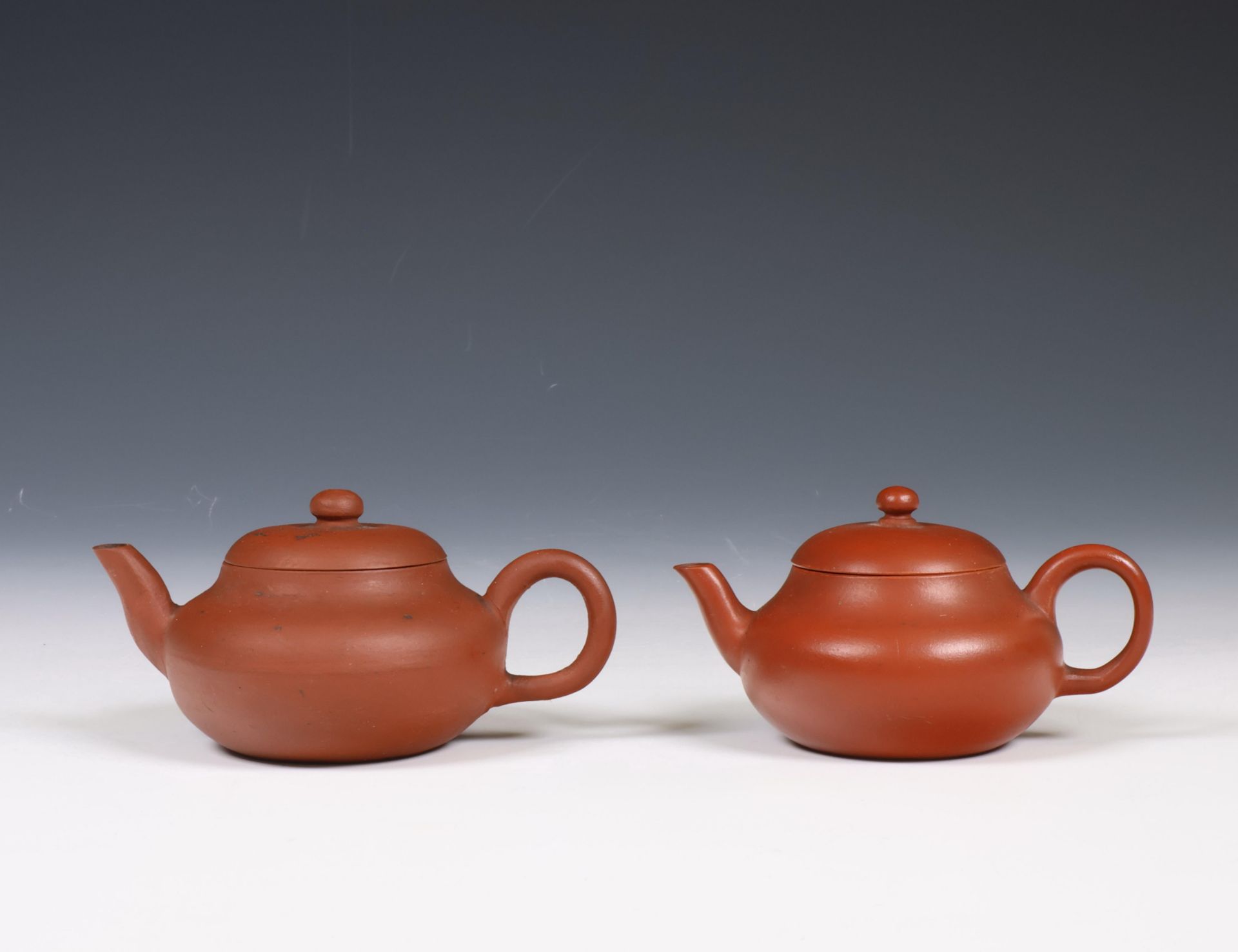 China, two Yixing earthenware teapots and covers,
