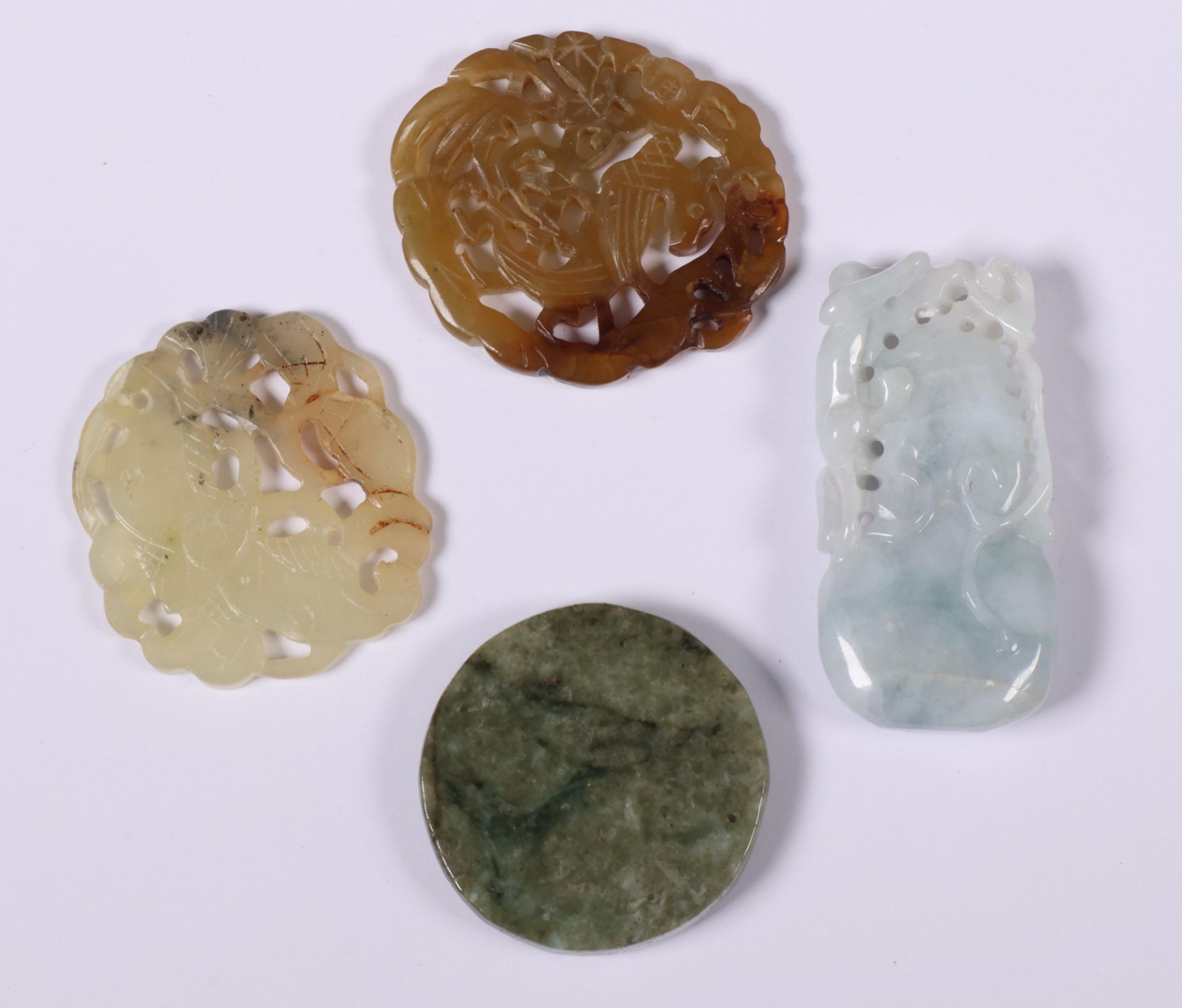 China, four various jade and jadeite pendants, 20th century, - Image 2 of 2