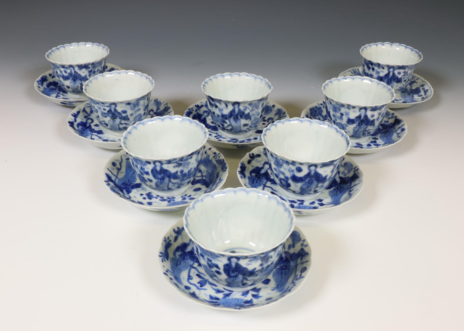 Japan, set of eight blue and white porcelain cups and saucers, 19th century,