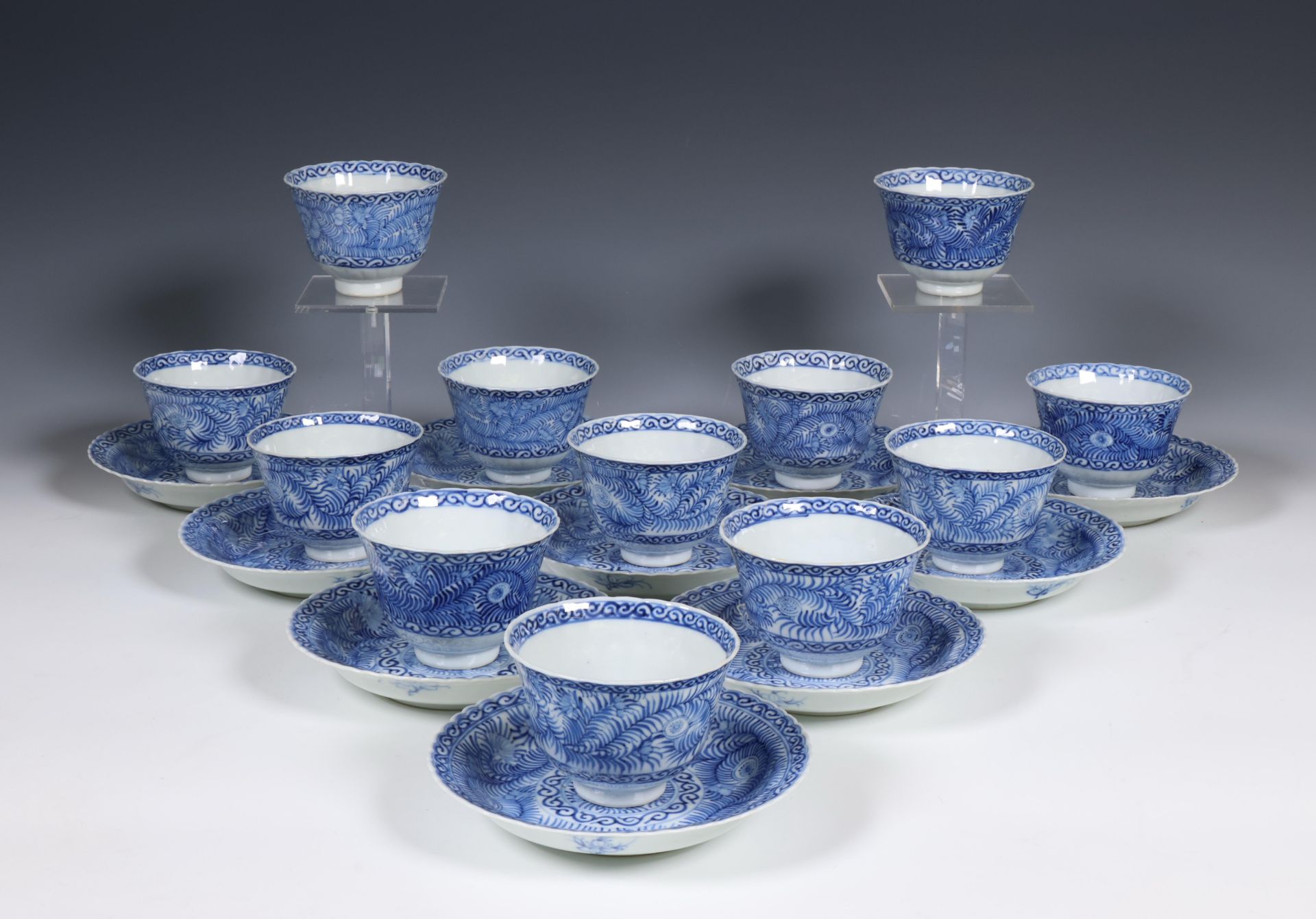 China, set of twelve blue and white porcelain cups and ten saucers, 19th century,