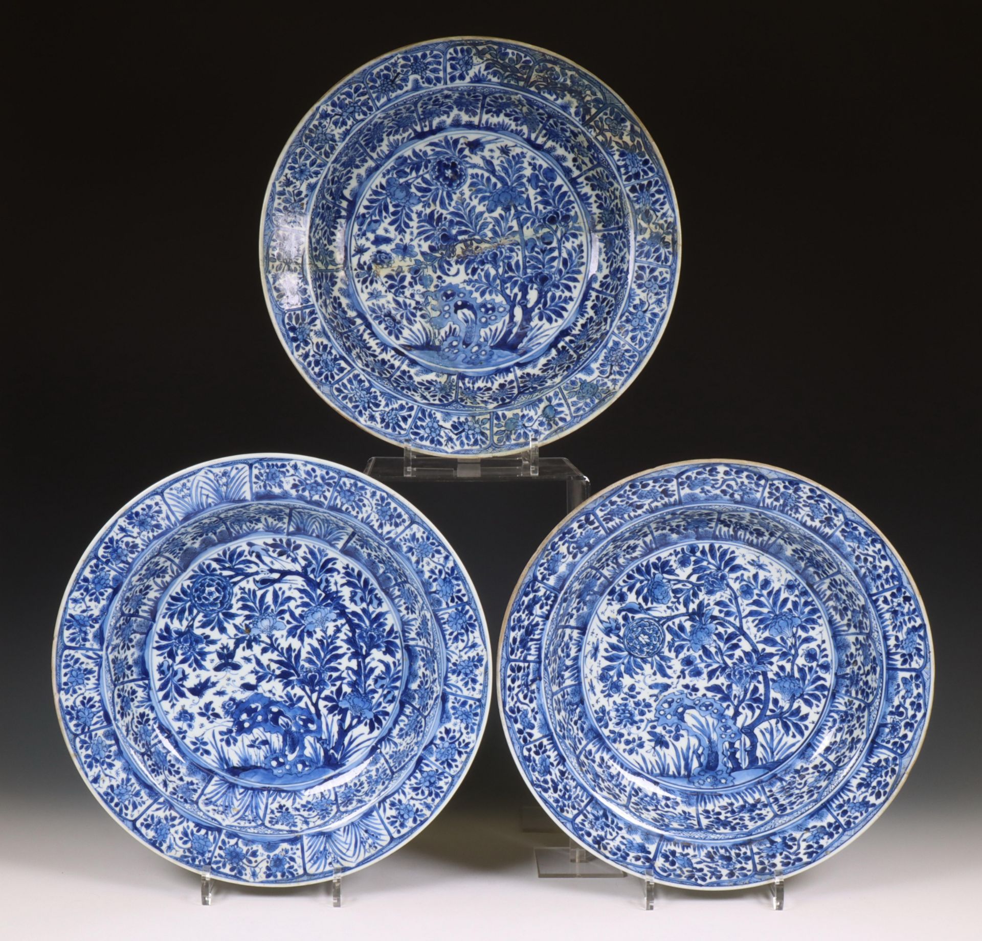 China, set of three blue and white porcelain deep dishes, Kangxi period (1662-1722),