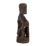 Philippines, Luzon, Ifugao, a small wooden ritual figure for us by a priest, mumbaki.