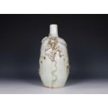 China, Celadon vase with decoration of grape leaves in relief, 19th century.