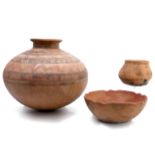 Three Carribean earthenware pots;