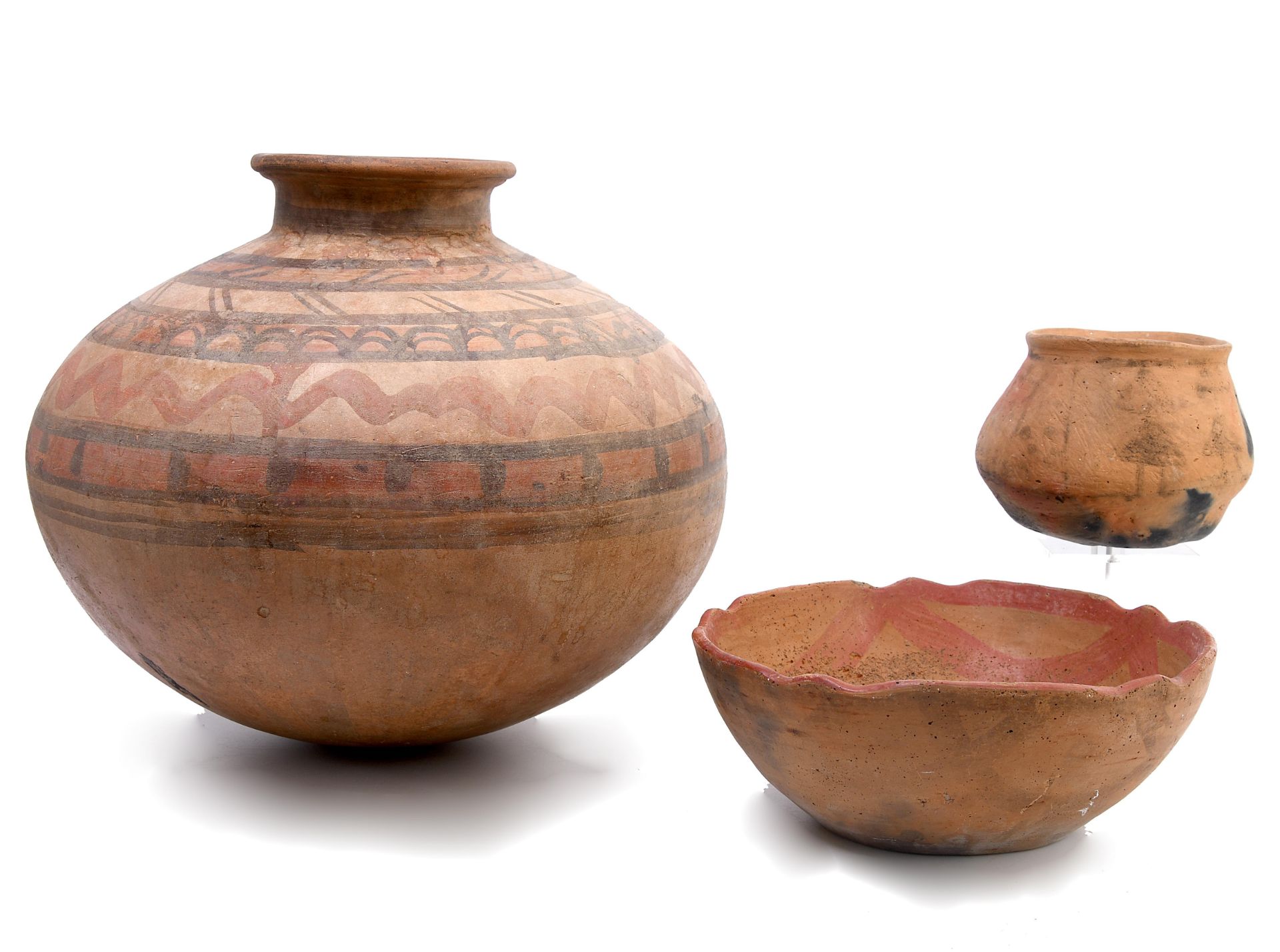 Three Carribean earthenware pots;