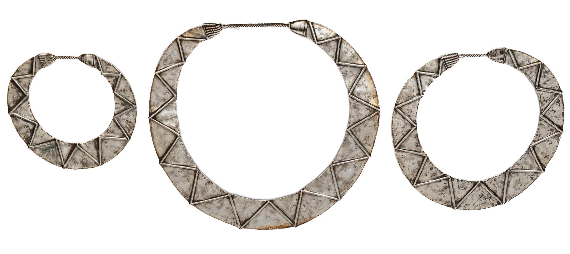 China, Guizhou, Miao, Jianhe area, a silver alloy necklace in three separate broad bands;