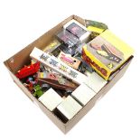 Box with various metal and plastic cars