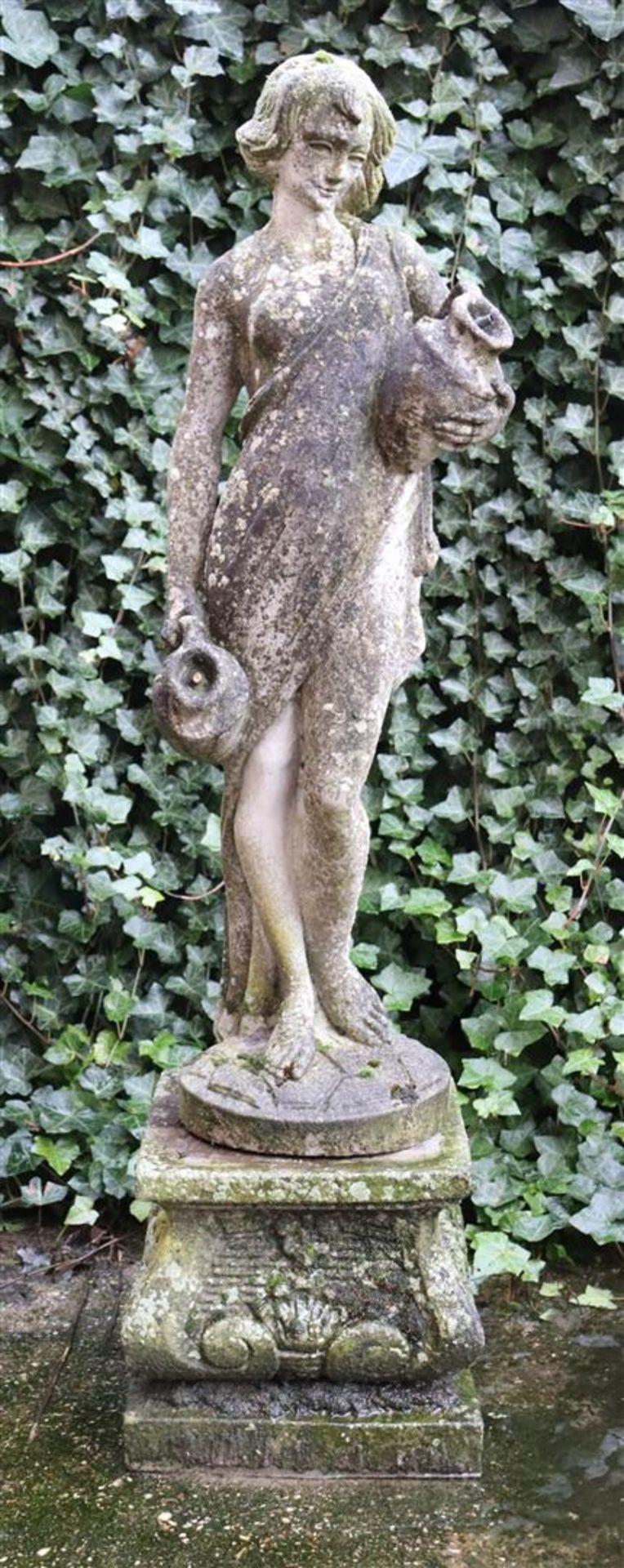 Composite garden sculpture of a woman