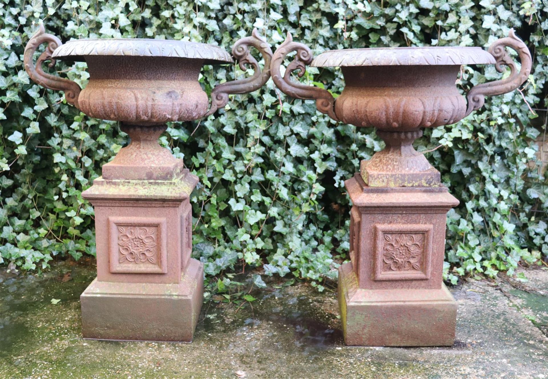 2 cast iron garden vases