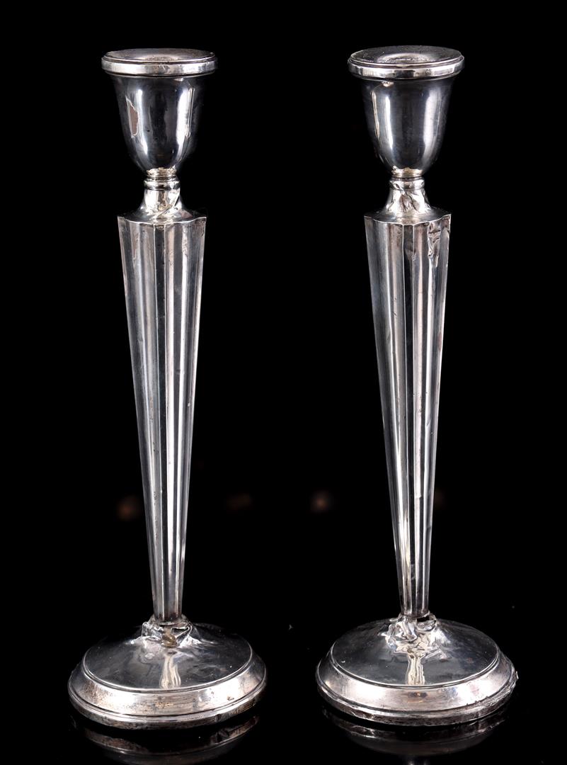 2 silver candlesticks