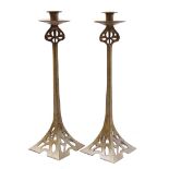 2 cast iron candlesticks