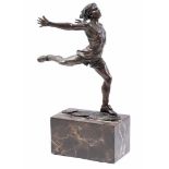 Bronze sculpture of a dancing man