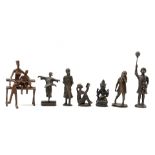 7 bronze figurines of children