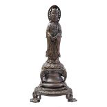 Copper statue of a standing Buddha
