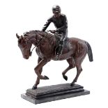 Metal statue of a jockey