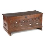 Oak blanket chest with gothic style stitching, standing on slipper legs