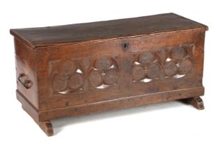 Oak blanket chest with gothic style stitching, standing on slipper legs