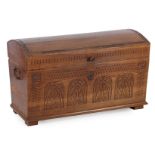 Oak blanket chest with convex lid and stitchwork in the front