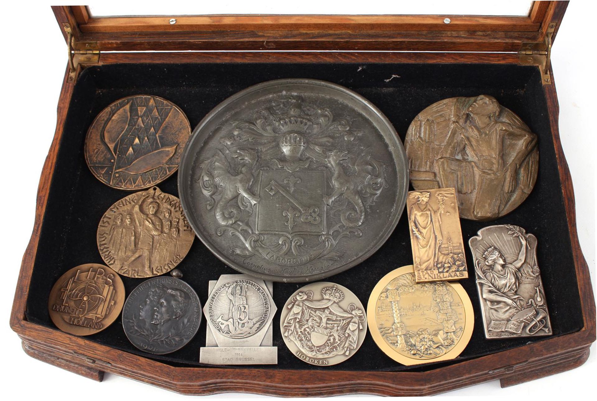 Oak collector's cabinet containing 11 medals