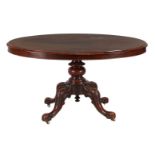 Oval walnut dining room table with tiltable top and pierced column leg