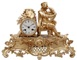 Classic gold-colored mantel clock with painter on top