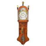 Frisian tail clock with painted dial in oak case with copper balls