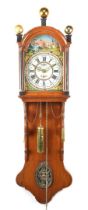 Frisian tail clock with painted dial in oak case with copper balls