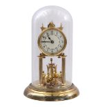 Brass bell jar clock with glass bell jar