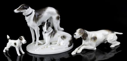 3 porcelain statues of dogs
