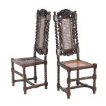 2 oak chairs with webbing, beautiful stitching in the back, twisted columns