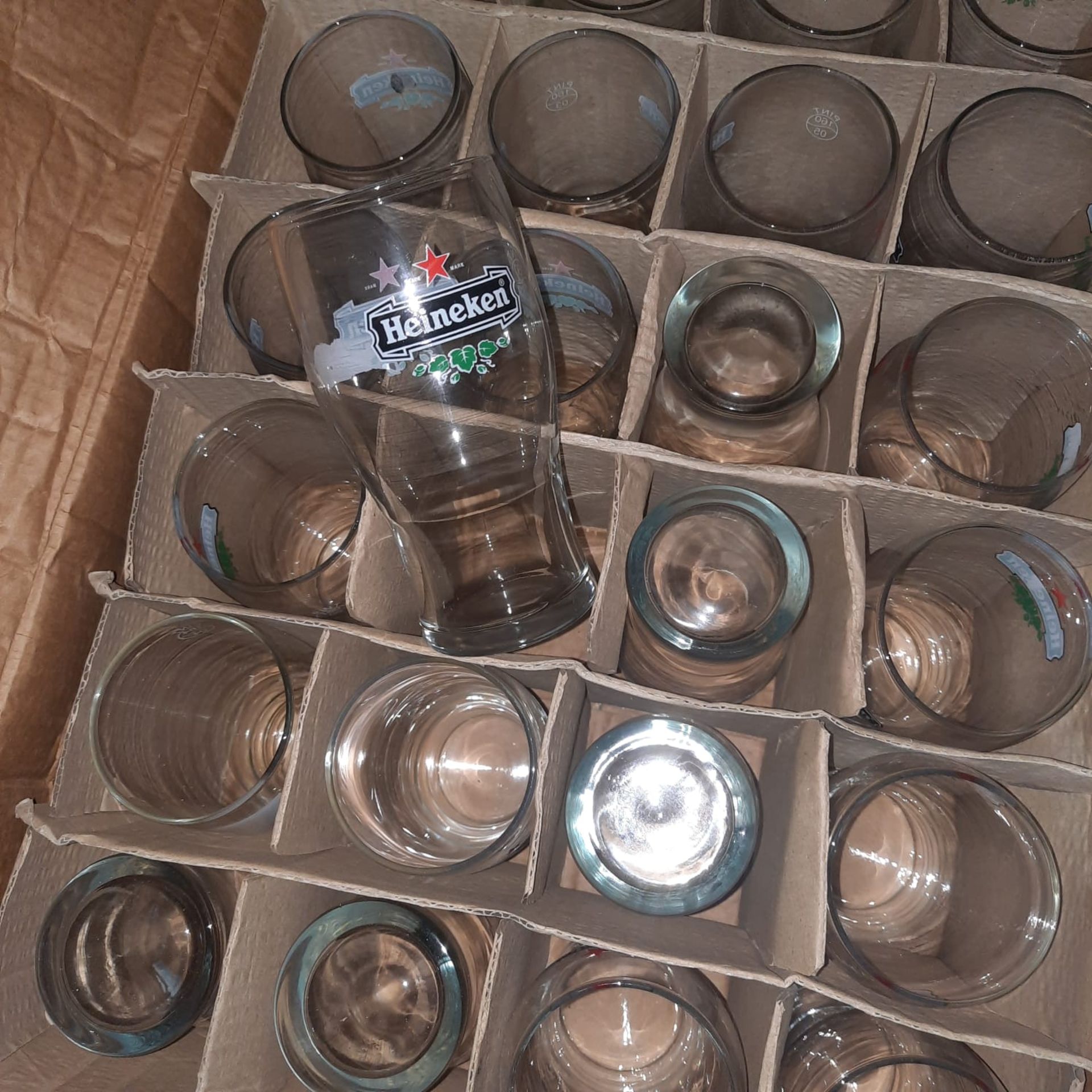 X 22 HEINEKEN PINT GLASSES - NEW - DAMAGED BOX.